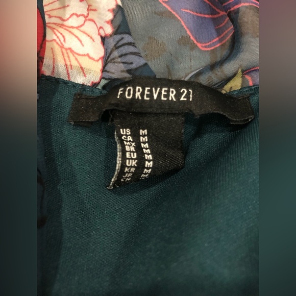 Floral crop top with sheer sleeves; button for front closure, ruffle trim bottom - Picture 2 of 9